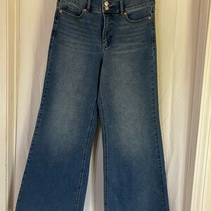 Sofia Vergara wide leg jeans raw hem light wash